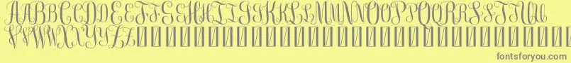Fonte FreeMonogram Beta 0 5 – fontes cinzas em um fundo amarelo
