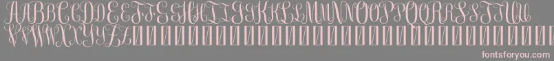 FreeMonogram Beta 0 5 Font – Pink Fonts on Gray Background