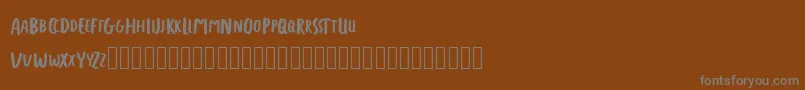 Шрифт FREETAPE – серые шрифты на коричневом фоне