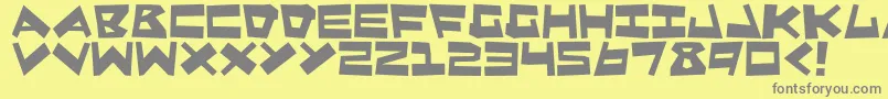 QuakeShake-fontti – harmaat kirjasimet keltaisella taustalla