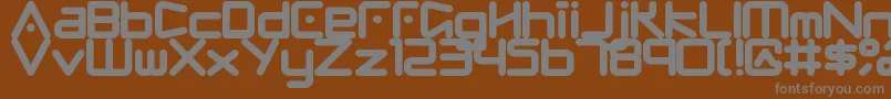 Fringe-fontti – harmaat kirjasimet ruskealla taustalla