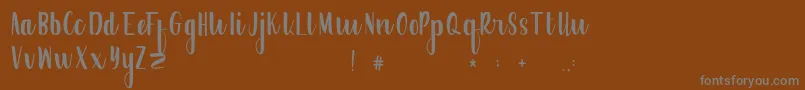 More about FrogresFree Font FrogresFree Font – Gray Fonts on Brown Background
