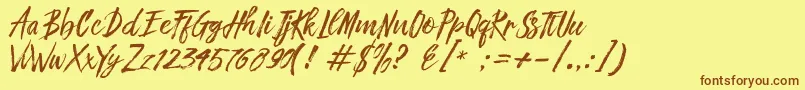 フォントFronte Script – 茶色の文字が黄色の背景にあります。