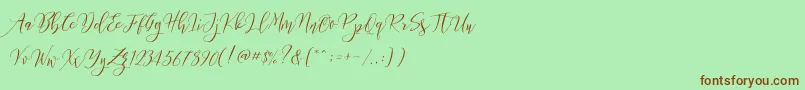 Frutilla Script Font – Brown Fonts on Green Background