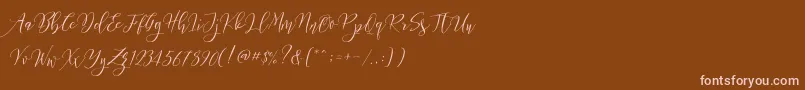 Frutilla Script-fontti – vaaleanpunaiset fontit ruskealla taustalla