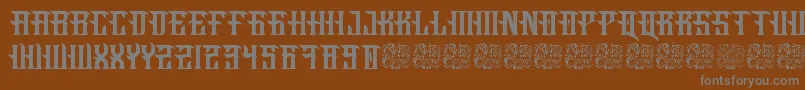 Fucking Hostile-fontti – harmaat kirjasimet ruskealla taustalla