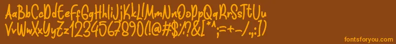 Funnis Font D by 7NTypes-fontti – oranssit fontit ruskealla taustalla