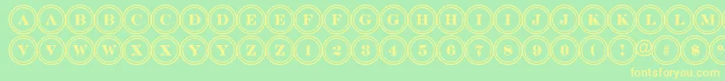 フォントDiscoserifdblRegular – 黄色の文字が緑の背景にあります