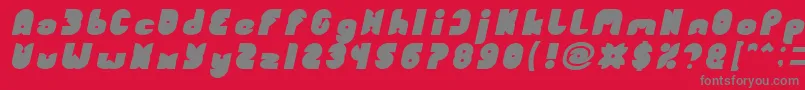 FUNNY SPORT Bold Italic-fontti – harmaat kirjasimet punaisella taustalla