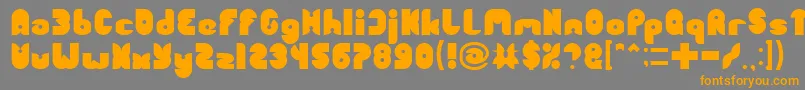 フォントFUNNY SPORT – オレンジの文字は灰色の背景にあります。