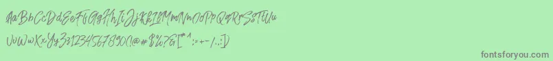 Fusterd Brush-Schriftart – Graue Schriften auf grünem Hintergrund