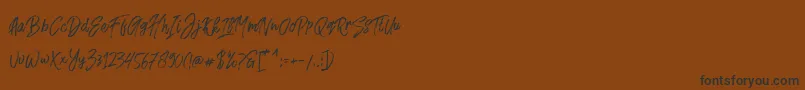 Fusterd Brush Font – Black Fonts on Brown Background