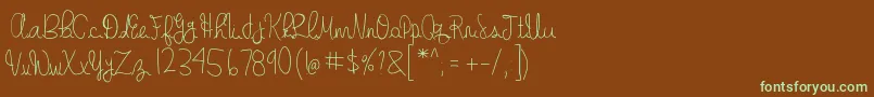 フォントgabbi s handwriting – 緑色の文字が茶色の背景にあります。