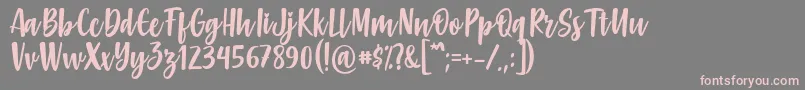 フォントGabelisa Font by Keithzo 7NTypes – 灰色の背景にピンクのフォント