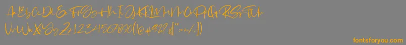 フォントGabrialle – オレンジの文字は灰色の背景にあります。