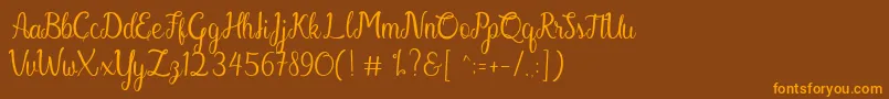 En savoir plus sur la police Gabriella Police Gabriella – polices orange sur fond brun