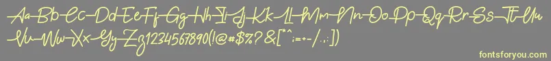 フォントGabuek Script – 黄色のフォント、灰色の背景