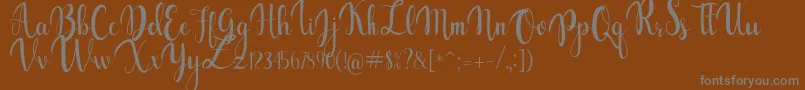 gabylia-Schriftart – Graue Schriften auf braunem Hintergrund