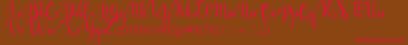 gabylia-Schriftart – Rote Schriften auf braunem Hintergrund