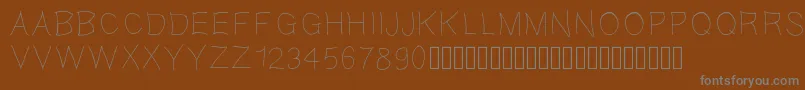 Gaellefine-fontti – harmaat kirjasimet ruskealla taustalla