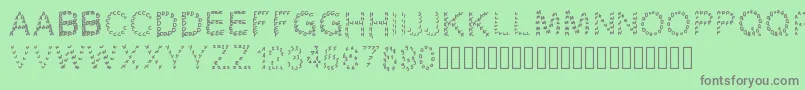 フォントGaellingpates – 緑の背景に灰色の文字