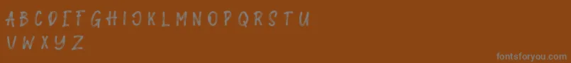 Galahad-Schriftart – Graue Schriften auf braunem Hintergrund