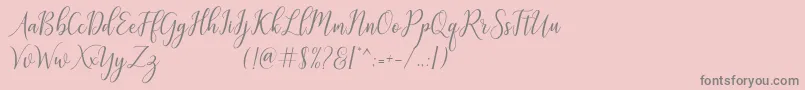 フォントgalatia – ピンクの背景に灰色の文字
