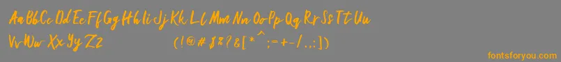 フォントGallant – オレンジの文字は灰色の背景にあります。