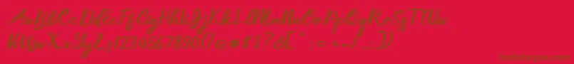 Fonte Gallisia Design Script – fontes marrons em um fundo vermelho