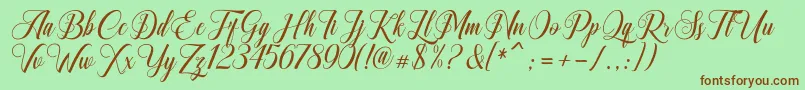 Fonte Ganesha Script – fontes marrons em um fundo verde