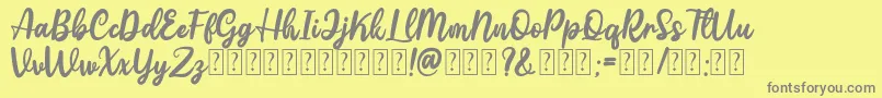 Gattely DEMO-Schriftart – Graue Schriften auf gelbem Hintergrund