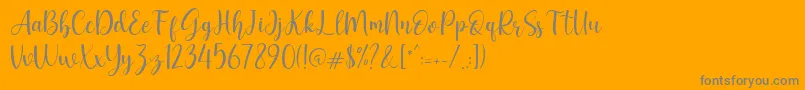 Geishela-Schriftart – Graue Schriften auf orangefarbenem Hintergrund