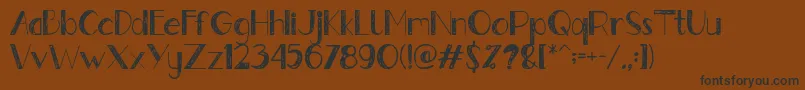 フォントGently – 黒い文字が茶色の背景にあります