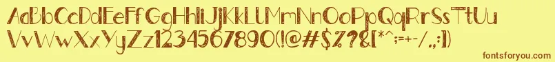 フォントGently – 茶色の文字が黄色の背景にあります。
