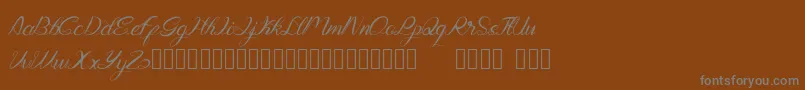 Genttalla-Schriftart – Graue Schriften auf braunem Hintergrund