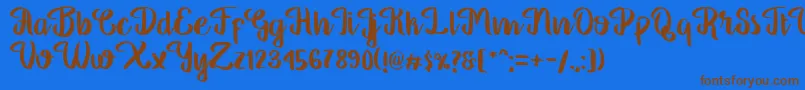 フォントGeorgia Script – 茶色の文字が青い背景にあります。