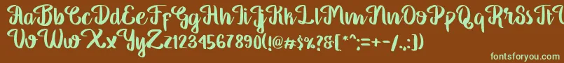 フォントGeorgia Script – 緑色の文字が茶色の背景にあります。