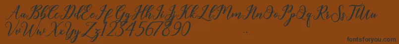Geralyn Font – Black Fonts on Brown Background