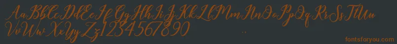 Geralyn-fontti – ruskeat fontit mustalla taustalla