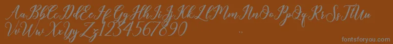 Шрифт Geralyn – серые шрифты на коричневом фоне