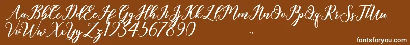 Geralyn-fontti – valkoiset fontit ruskealla taustalla