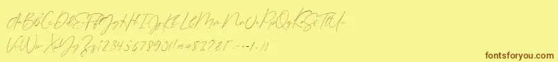 フォントGermany Script Demo – 茶色の文字が黄色の背景にあります。