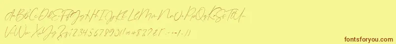 Fonte Germany Script Demo – fontes marrons em um fundo amarelo