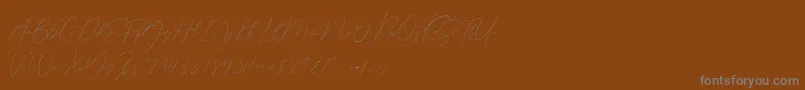 Germany Script Demo-Schriftart – Graue Schriften auf braunem Hintergrund