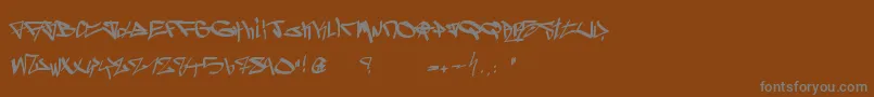 Ghetto Blasterz-Schriftart – Graue Schriften auf braunem Hintergrund