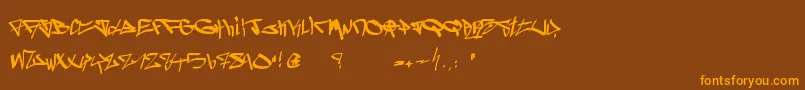 フォントGhetto Blasterz – オレンジ色の文字が茶色の背景にあります。