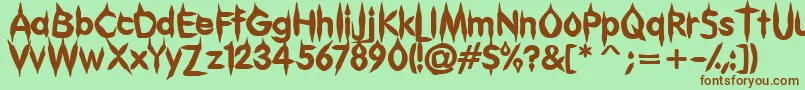 Gibberish-Schriftart – Braune Schriften auf grünem Hintergrund