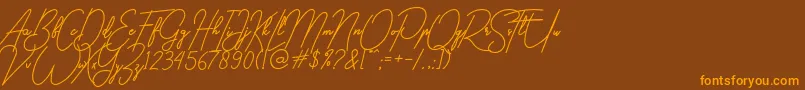 gilberta Font – Orange Fonts on Brown Background