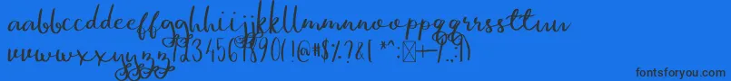 GinaAnn Font – Black Fonts on Blue Background
