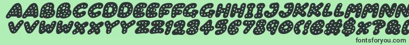 Fonte Gingerbread Italic – fontes pretas em um fundo verde